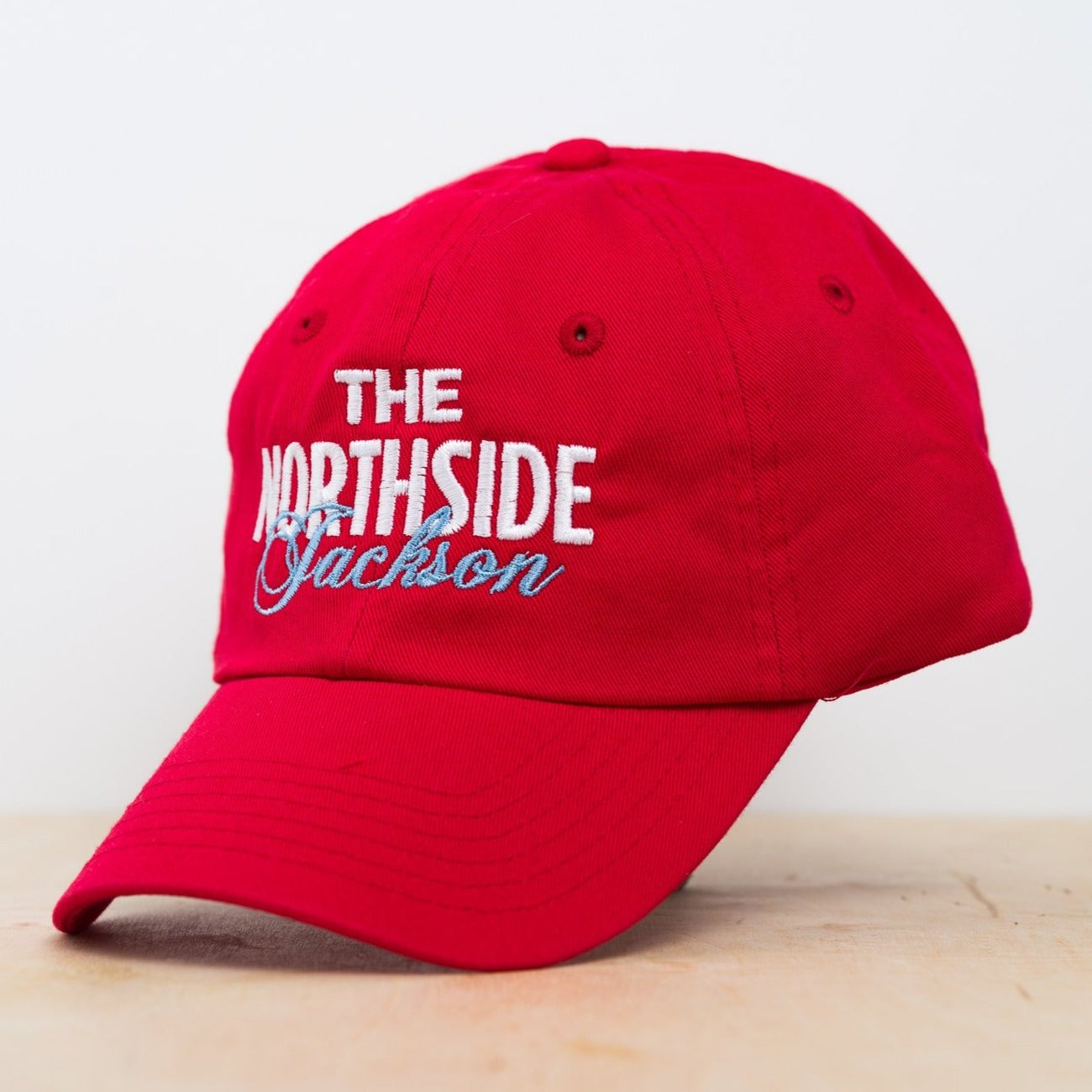 red embroidered hat with the northside jackson