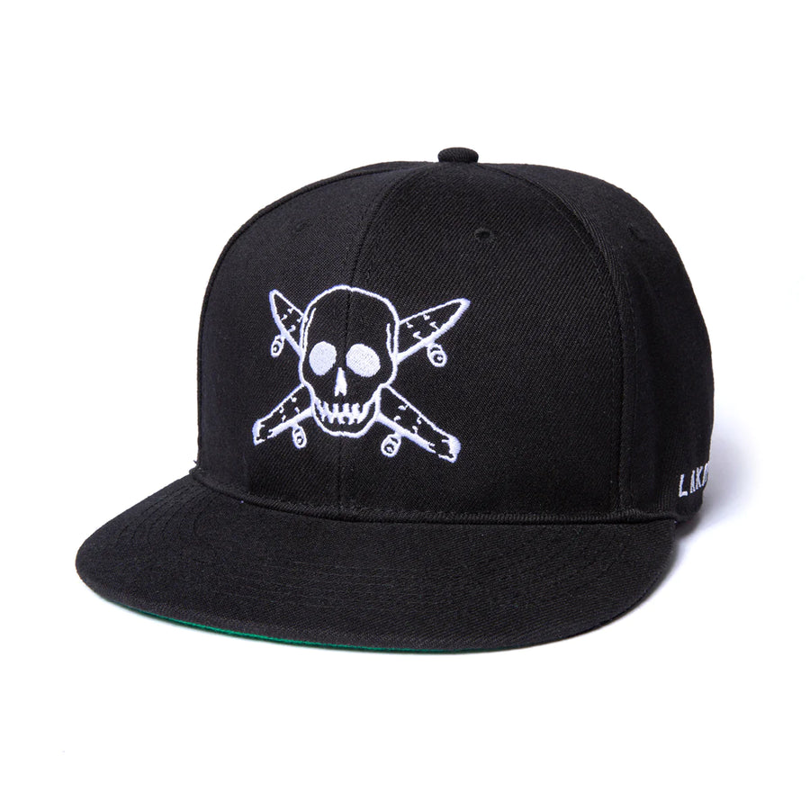 black lakai fitted hat featuring a skull and skateboard cross bones