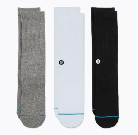 Three pairs of Stance Icon socks in gray, black, and white colors, displayed horizontally.