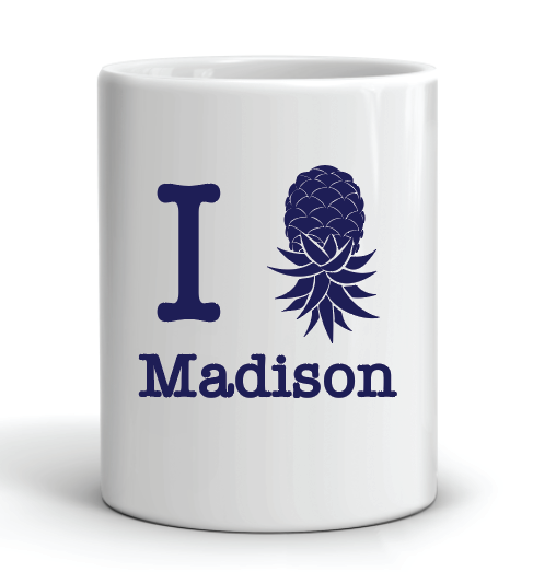 coffee mug featuring the slogan i swing madison mississippi with a pineapple instead of a heart