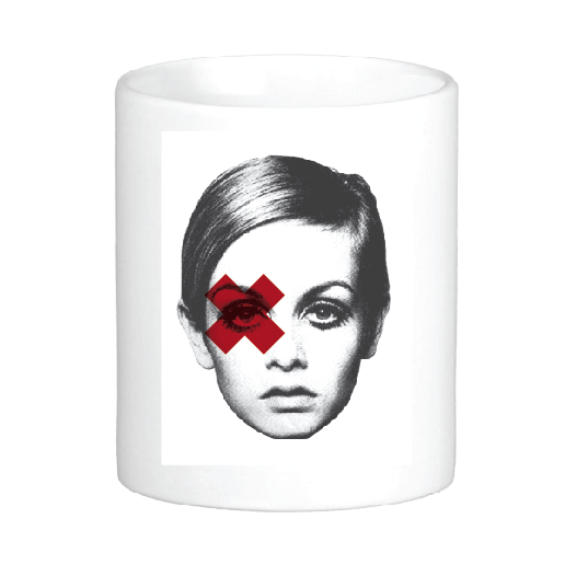 coffee mug featuring iconic super model twiggy or perhaps edie sedgwick with a red X over her right eye
