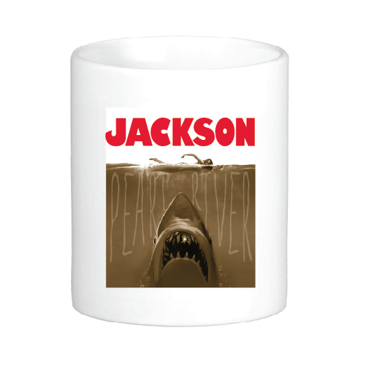 coffee mug featuring the jaws shark with a gold tooth in the pearl river