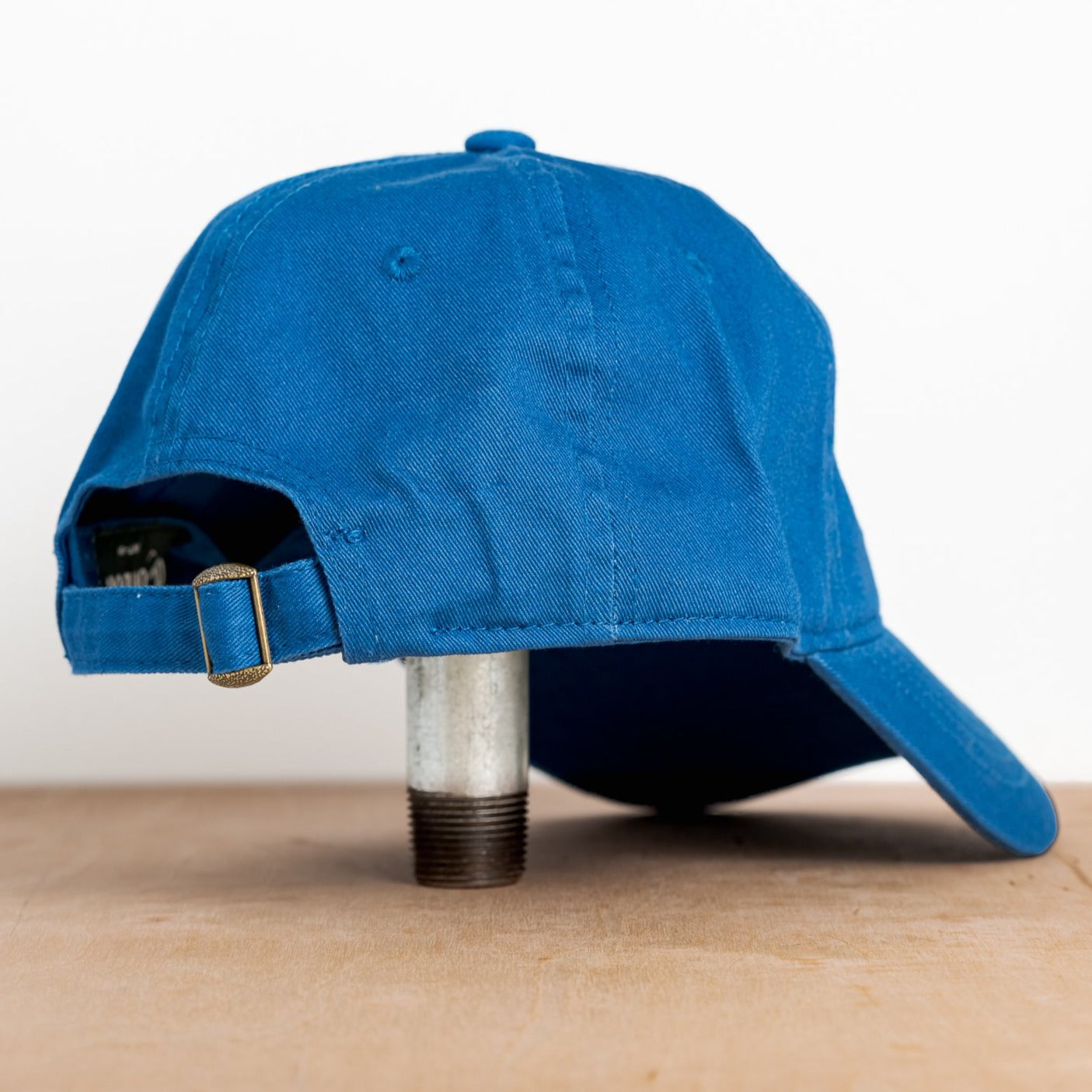 royal blue embroidered hat featuring the ski mississippi logo in green brown and orange